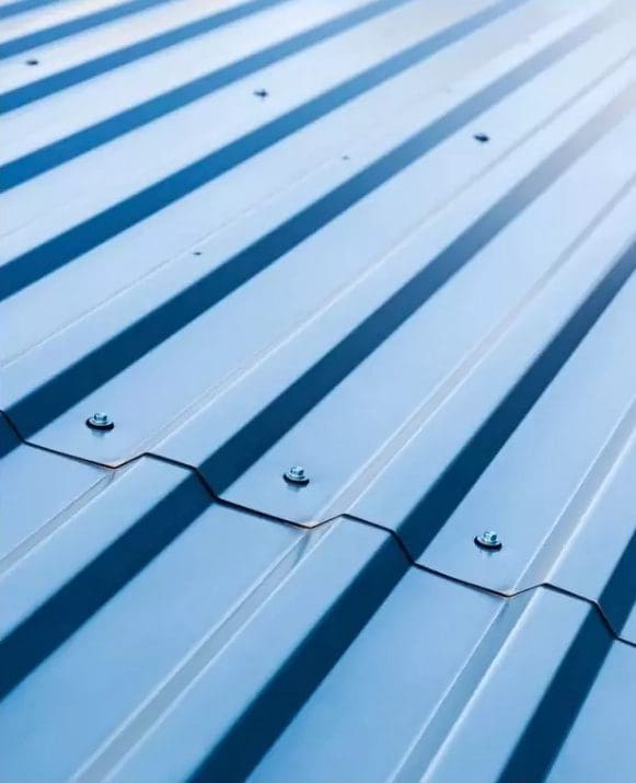 A close up view of a blue corrugated metal roof.